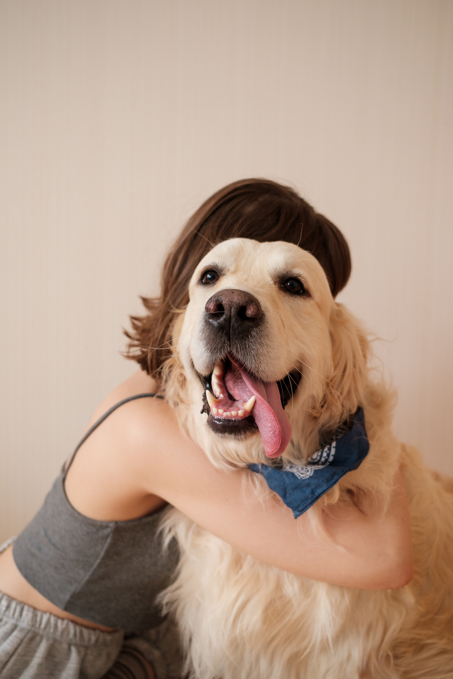 Young Woman Hugging Pet Dog